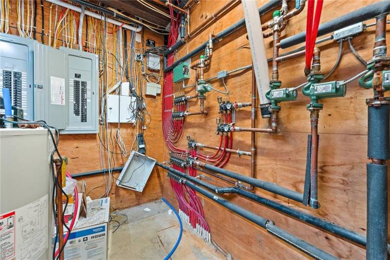 MECHANICAL ROOM WITH RADIANT HEAT AND ELECTRIAL PANELS ARE