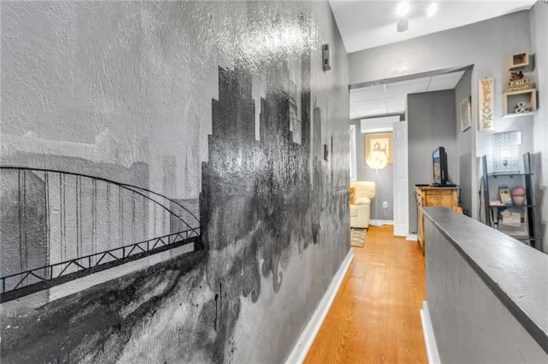 Pittsburgh skyline artwork leads to bedroom 2