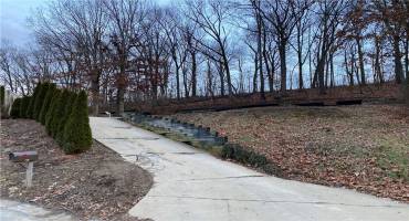 View of the lot and driveway from the street