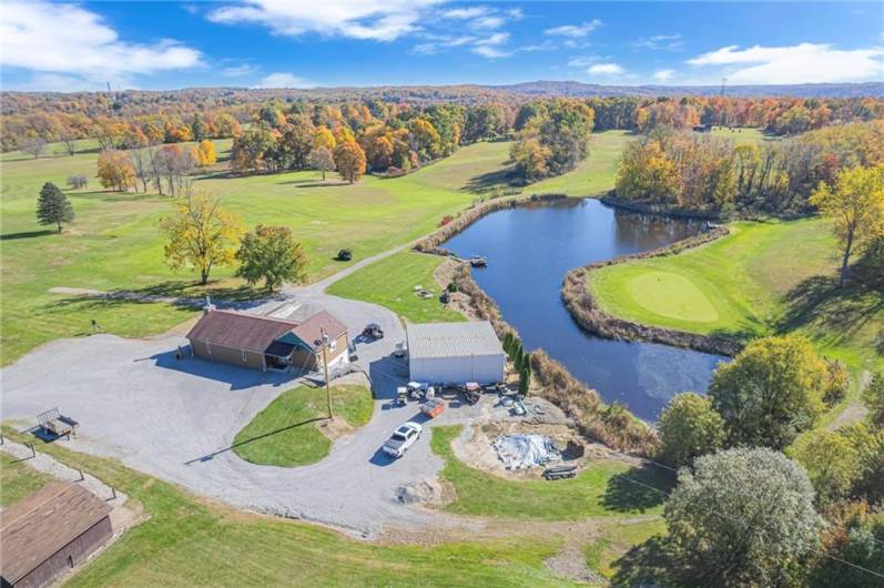 Arial of lodge, cart barn and large pond