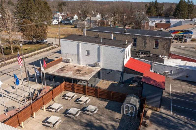 PROPERTY IS THE BUILDINGS IN FRONT OF THE 2 RED ROOF AREAS