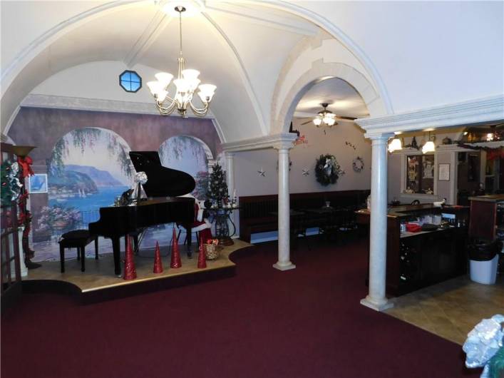 DOMED CEILING IN THE PIANO BAR AREA HIGHLIGHTED WITH WHITE PILLARS.  GRAND PIANO FOR YOUR PRIVATE PARTY ARRANGEMENTS OR DINING PLEASURE.