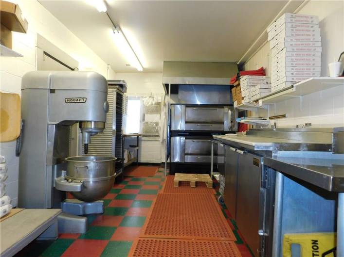 CLEAN FULLY EQUIPPED KITCHEN/ THERE ARE ALSO WALK IN COOLERS