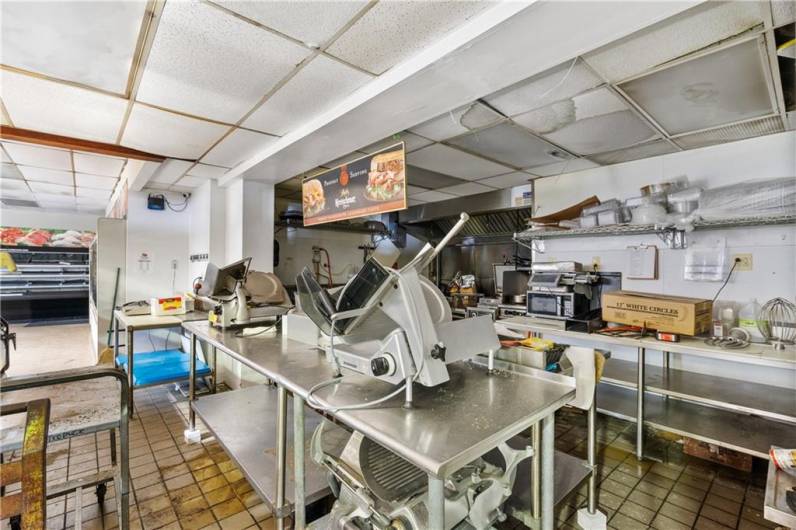 Deli food prep kitchen area behind deli counter