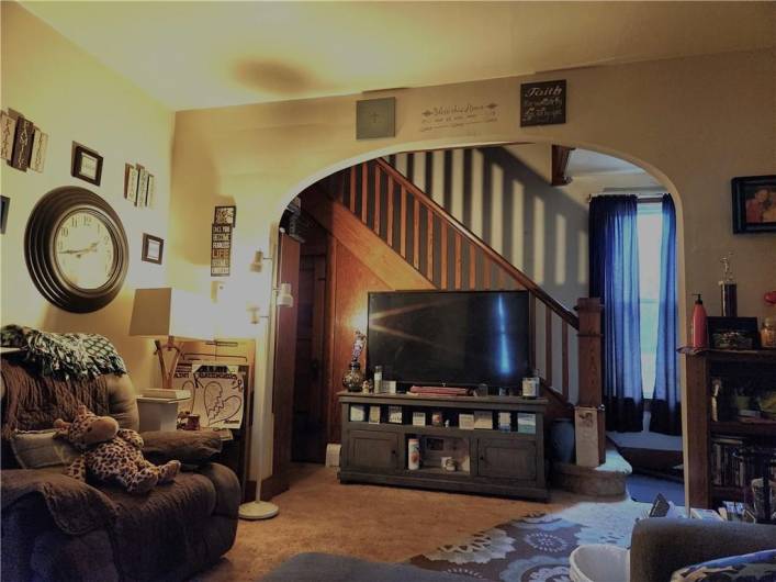 Full of character, the curved doorways is perfect for the entertainment area.  Look at that staircase.