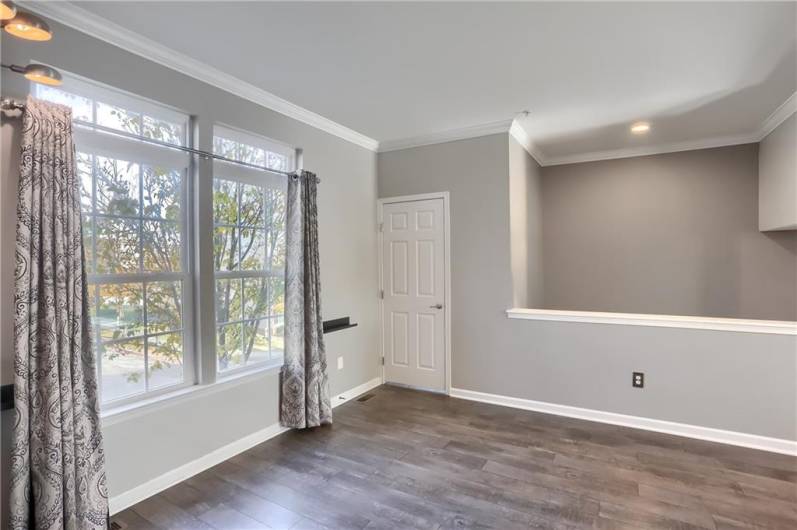 The family room is filled with natural lighting the sparkles on the newer modern floors.