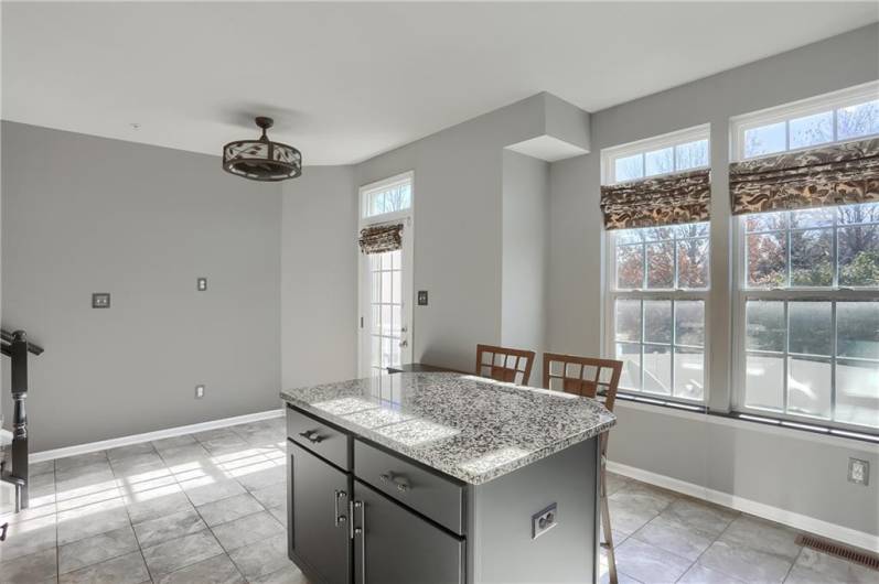 Sun floods the kitchen and illuminates the main level living space.