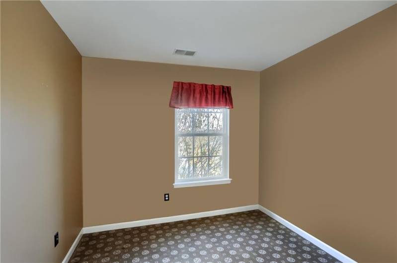 Spacious, luminous guest bedroom will delight any guest.