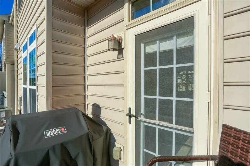 A quaint rear deck features a gas line for our outdoor grilling.