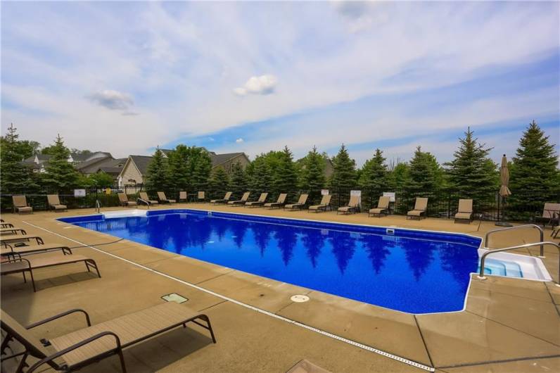 Bellevue Park community pool is heated and provides chairs for relaxing.