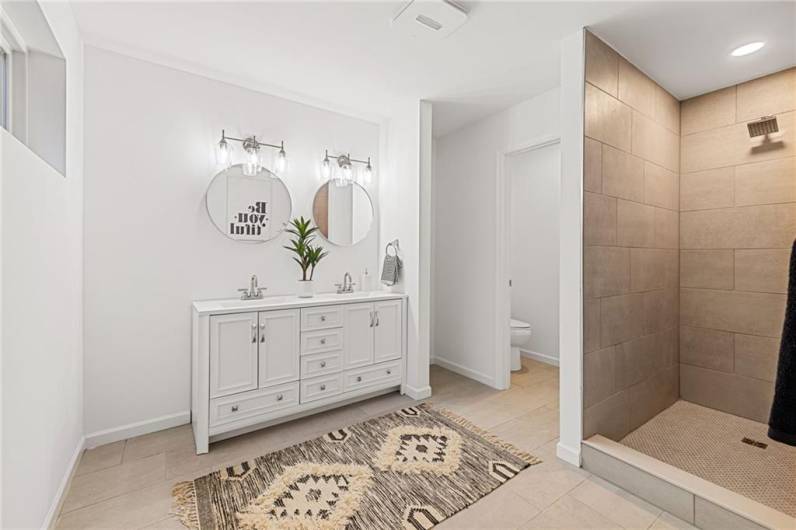 The primary bedroom features a tiled shower and modern finishes!