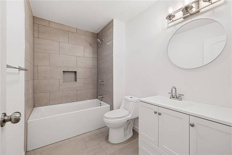 Stunning guest bathroom with a tub/shower combo!