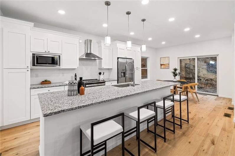 So much storage and counter space. The home is very modern and welcomes natural light with its light colored floors and walls. So many windows!