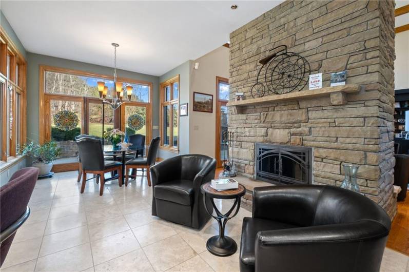 Kitchen seating/conversation area with stone double sided fireplace!