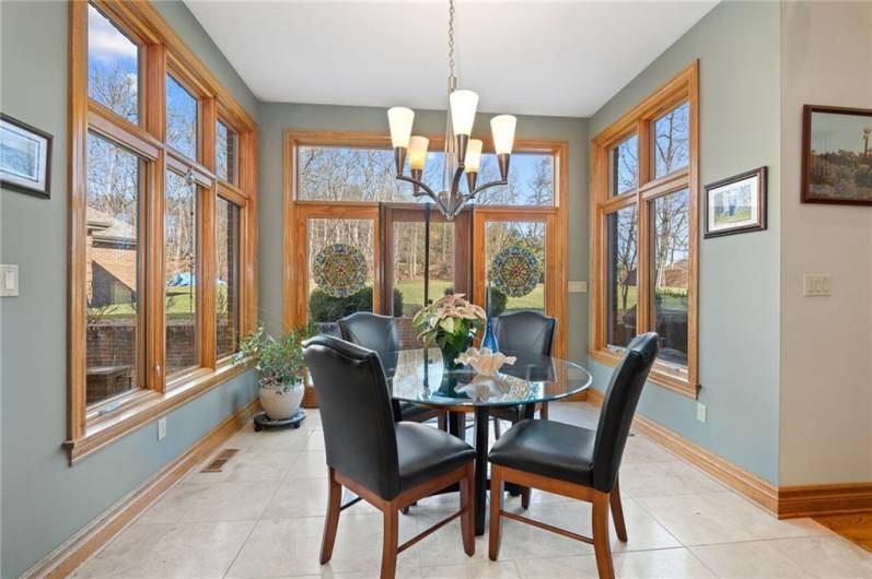 Breakfast area overlooks the back patio and yard!