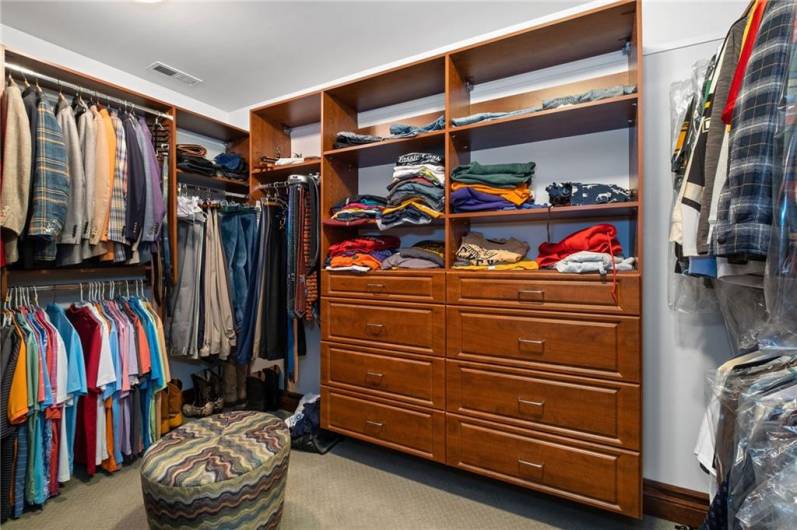 Master Bedroom walk in closet with custom shelving!  There is a second smaller walk in just across from this!