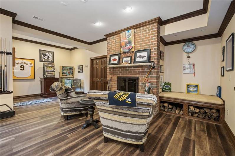 Seating area around the cozy fireplace on lower level!