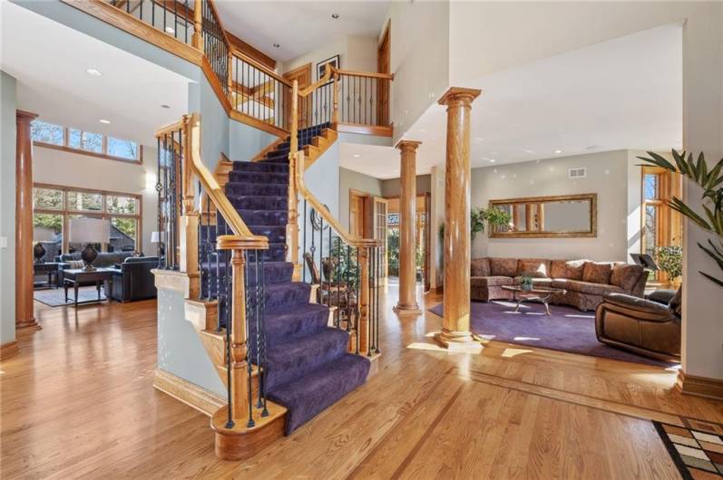 Entry with open Living Room, Dining Room and curved staircase to Upper Level!