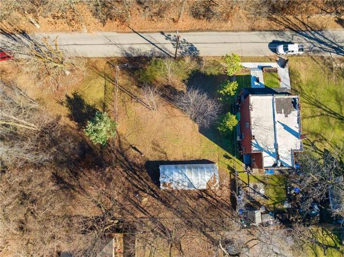 Right to Left, 6730, 6728, 6726, 6724 Simonton (125-K-82, 125-K-80, 125-K-81, 125-K-78), View north-west, fenced in previously home of Tree Pittsburgh