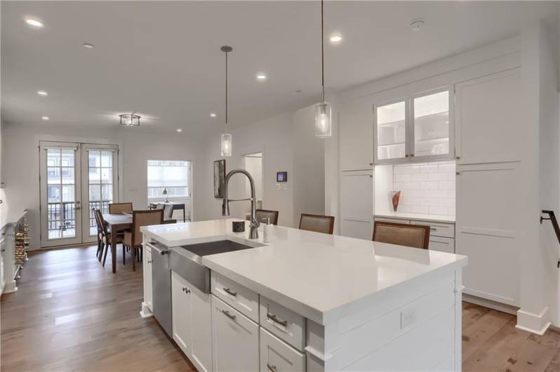 The kitchen opens to the dining room.