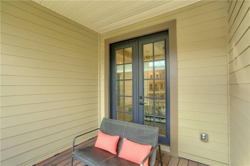 Enjoy mornings or an evening beverage on the deck accessible from the primary bedroom.