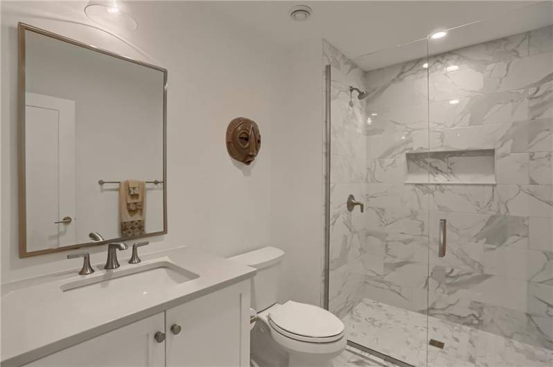 A third floor guest bathroom is equally impressive with luxurious finishes,