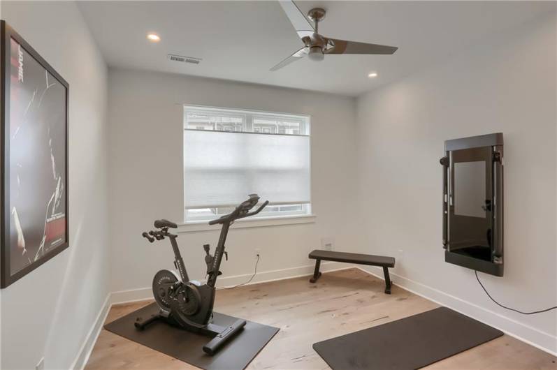 Another guest bedroom is featured in the finished lower level.