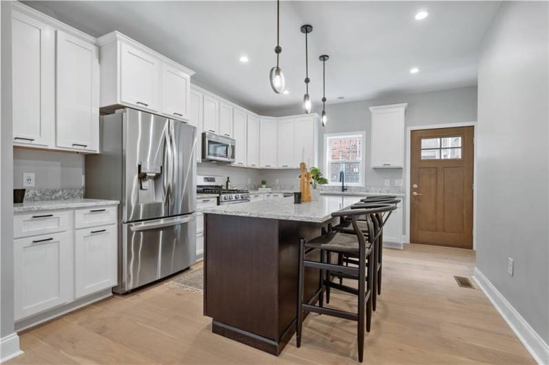 Rear door opens to a grassy area in the rear.Beautiful cabinets and countertops