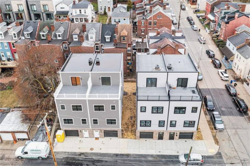 Aerial view of the houses on Davison! Photos are from former model home. This home has a reverse floor plan.