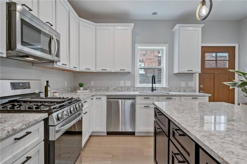 Amazing well equipped kitchen with eat-in islandand plenty of cabinetry. There also is a pantry!