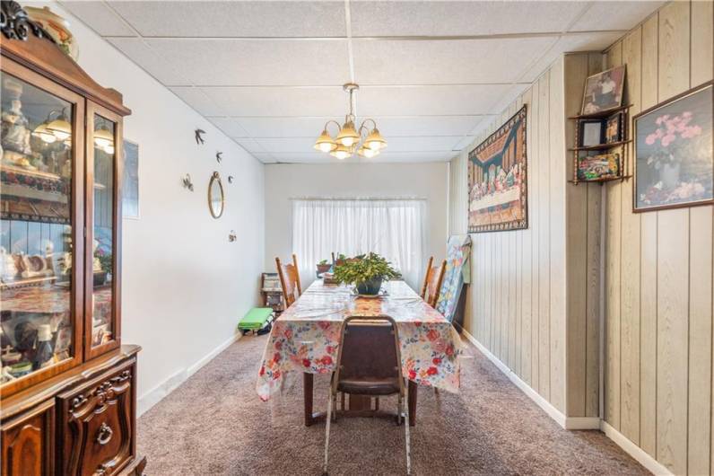 The formal dining room has plenty of space to showcase your favorite hutch, buffet and table.