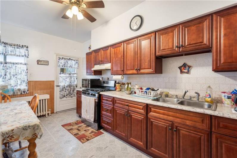 The kitchen walks out to the newer patio for added convenience.