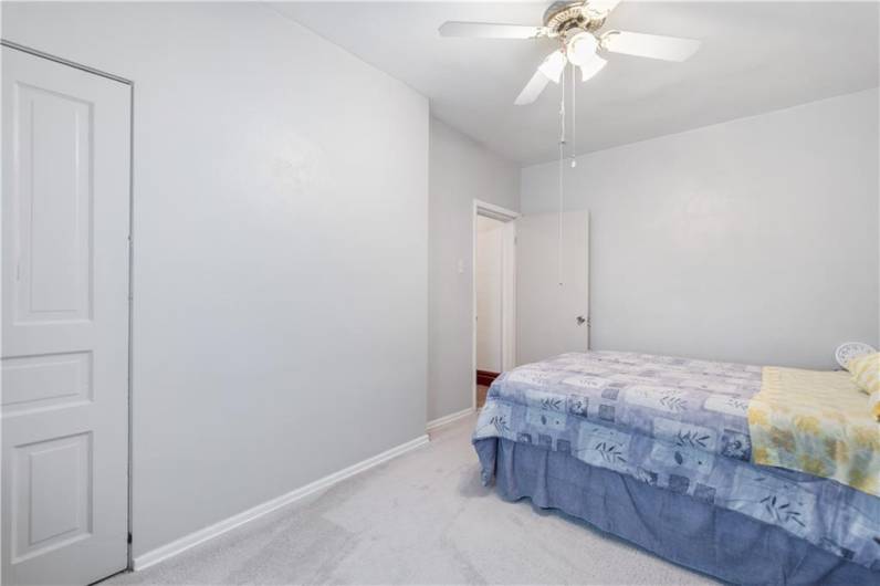 The owner's suite is light & bright with ample room for your king sized bed. Ceiling fan and fresh paint make this a wonderful retreat!