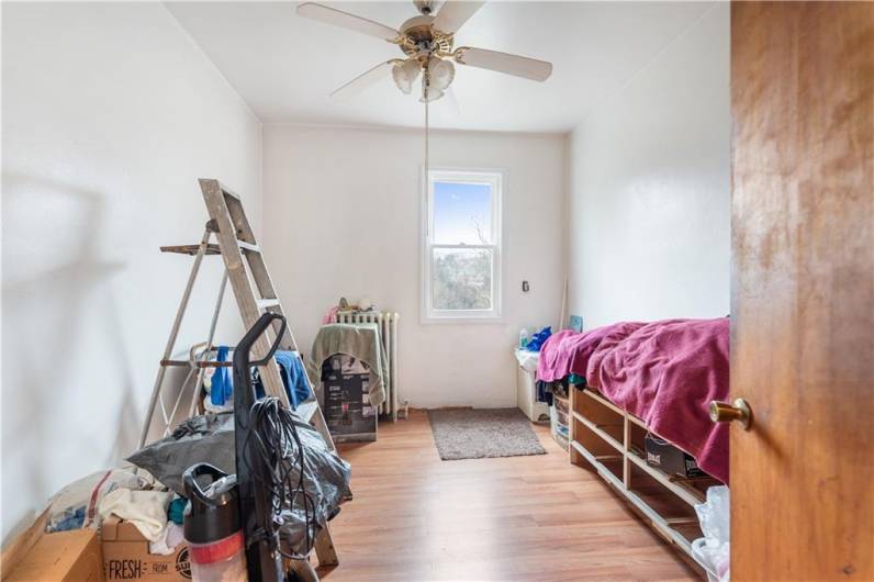 The 3rd bedroom has been freshly painted and new flooring added. Complete with ceiling fan and new window. Just add the trim & this will be a brand new room or office, whatever your needs may be!