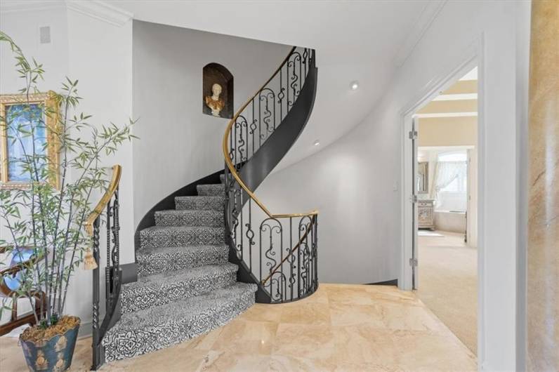 Impressive turned staircase with ornate wrought iron & brass railings.