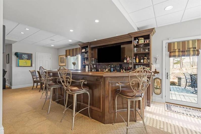 Impressive custom designed bar, back bar area with sink,  abundance of storage,60-inch beverage center, Gaggenau convection oven and Miele dishwasher