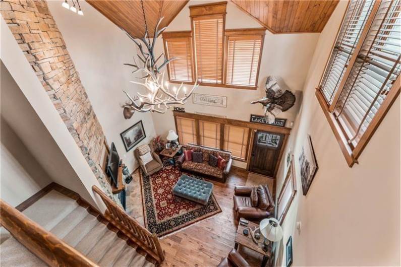 Unit 301, vaulted ceilings, floor to ceiling stone fire place, wood ceiling