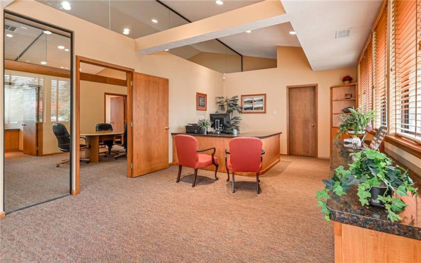 The Primary Office has a Glass Panel next to the Door into the Conference Room. The Door behind the Desk is to the Private Rest Room.