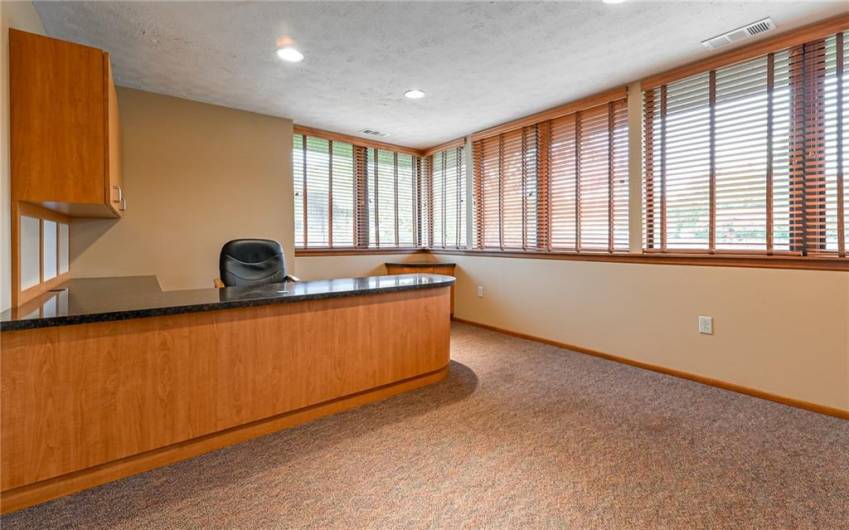 The large Office is approximately 13x13 and is situated across the Conference Room from the Primary Office