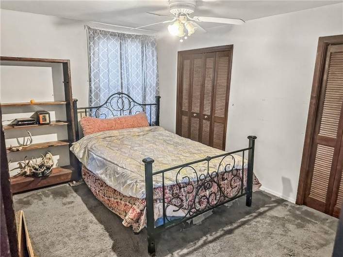 Large Primary Bedroom w/closet space galore, original woodwork, and excellent natural light!