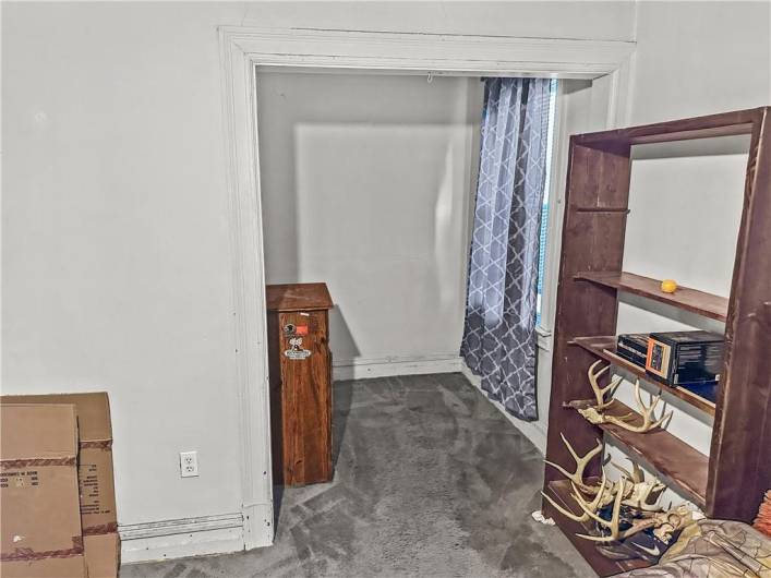 Large Primary Bedroom w/closet space galore, original woodwork,  and excellent natural light!