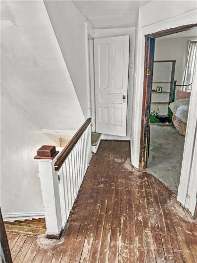 2nd Floor Hallway w/high ceilings, original main staircase/banister!