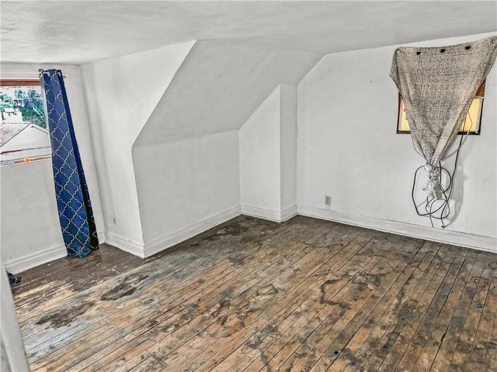 Large 3rd Floor bedroom w/original wood floors, large closet space, and excellent natural light!