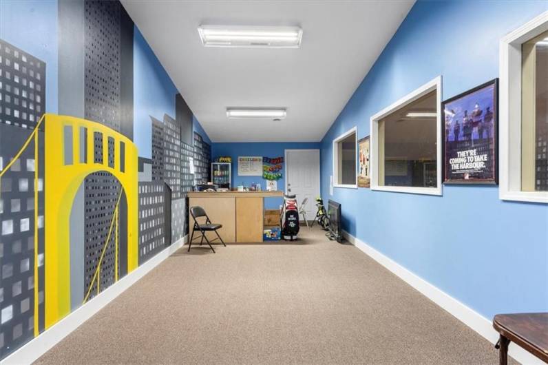 Entry room to the top level.  Windows, neutral carpet and plenty of space for whatever your needs are.