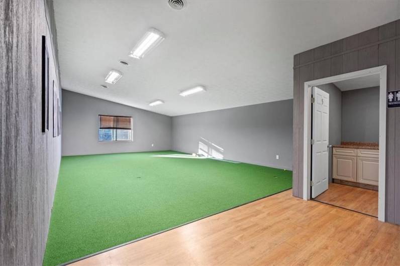 Upper level room with bath on the side. Vaulted ceiling and window add to the size of the room.