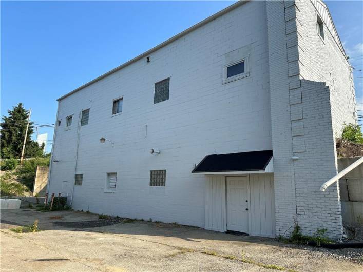 Man door and garage access to lower level of Building.