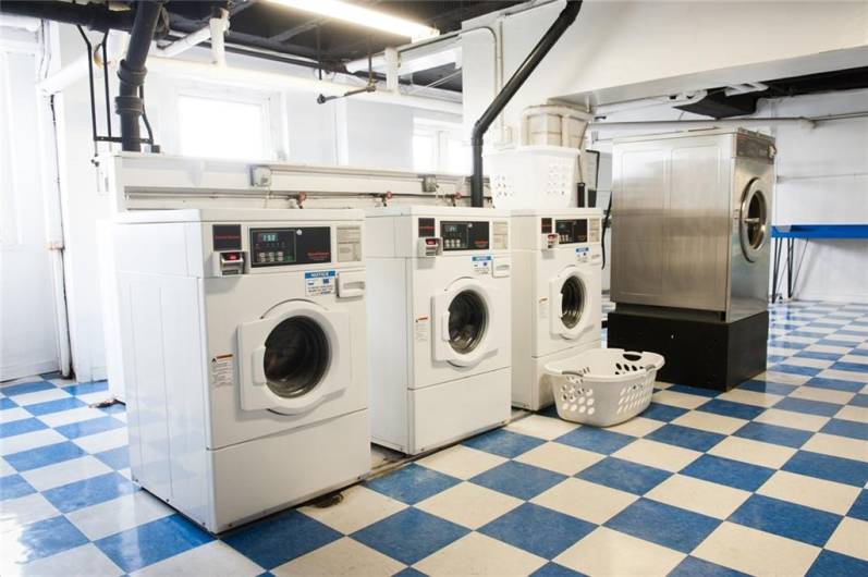 Card operated laundry machines and vending room.