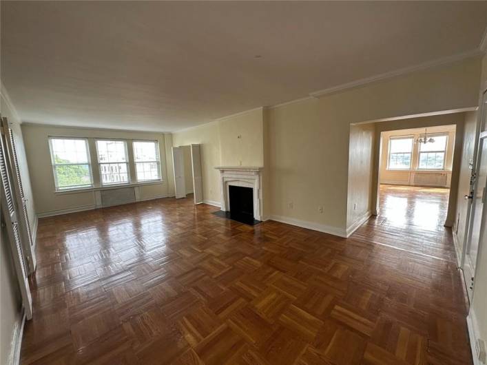 Upon entry you are greeted with sprawling parquet wood floors giving ample space for seating and entertaining.