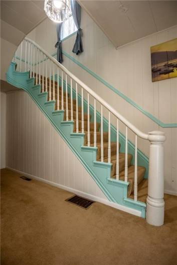 The decorative staircase makes for a grand entrance. The large foyer has endless possibilities.