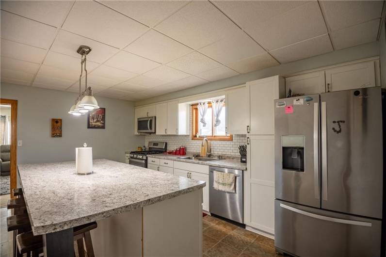 The spacious kitchen offers an amazing layout, an over-sized island and a stainless steel appliance package.
